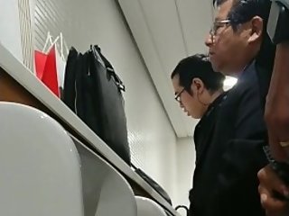 Handsome japanese guy pissing